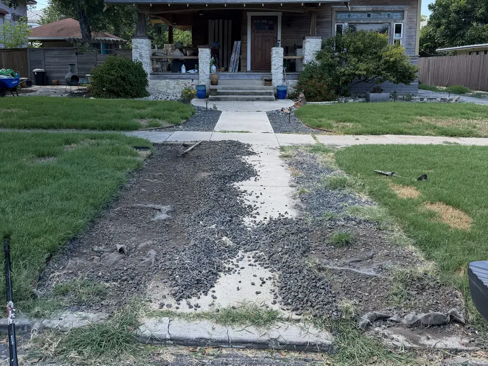 Fresh rock for two front beds · Before
