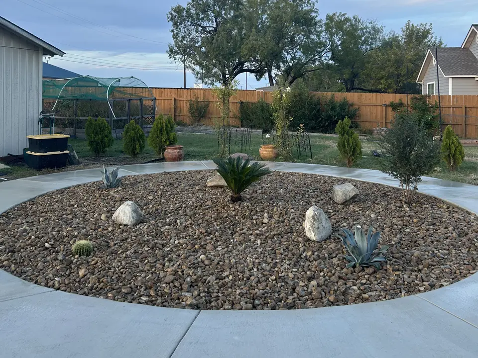 Overgrown bed to low-maintenance landscape · After